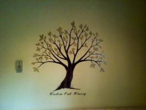 This paiting on the wall of the tasting room plays homage to the tree that inspired the winery name change.