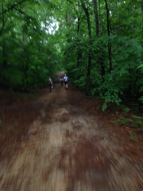 Mickey running and the boys biking in First Landing State Park